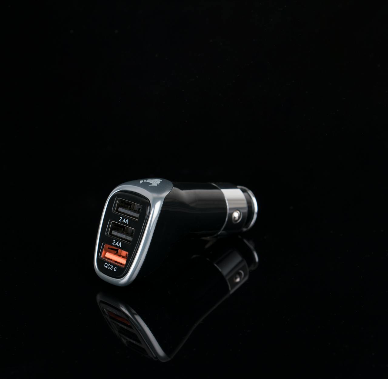 home-hero Sleek black car charger featuring multiple USB ports for versatile device charging.